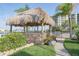 A gazebo featuring an outdoor seating area with lush landscaping and views of the marina at 660 Island Way #206 # 206, Clearwater, FL 33767