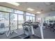 Well-equipped gym with treadmills, elliptical machines, and weights, offering views of the city at 660 Island Way #206 # 206, Clearwater, FL 33767