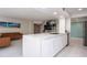 Modern kitchen with white cabinetry and quartz countertops open to the living area at 660 Island Way #206 # 206, Clearwater, FL 33767