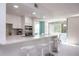 Modern kitchen with bar seating, stainless steel appliances, and a view at 660 Island Way #206 # 206, Clearwater, FL 33767