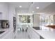 Bright kitchen leading to a breakfast nook with water views at 660 Island Way #206 # 206, Clearwater, FL 33767