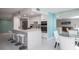 Bright, modern kitchen with white cabinets, quartz countertops, and stainless steel appliances at 660 Island Way #206 # 206, Clearwater, FL 33767