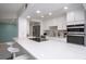 Spacious kitchen featuring white cabinetry, modern appliances, and stone countertop at 660 Island Way #206 # 206, Clearwater, FL 33767
