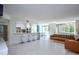 Open concept living room features breakfast bar, lots of natural light and access to the dining area at 660 Island Way #206 # 206, Clearwater, FL 33767