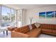 Cozy living room featuring floor-to-ceiling windows offering natural light and scenic views at 660 Island Way #206 # 206, Clearwater, FL 33767