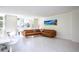 Bright living room featuring marble floors, large windows and an L-shaped couch at 660 Island Way #206 # 206, Clearwater, FL 33767