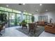 Inviting lobby featuring a seating area, natural light from large windows, and a view of the greenery outside at 660 Island Way #206 # 206, Clearwater, FL 33767