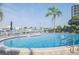 Community pool with lounge chairs overlooking the bay at 660 Island Way #206 # 206, Clearwater, FL 33767