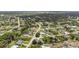 Aerial view of property in a quiet neighborhood with tree-lined streets at 7322 Ellis Ln, Port Charlotte, FL 33981