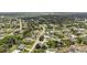 This aerial view showcases the serene neighborhood, mature trees, and beautiful homes at 7322 Ellis Ln, Port Charlotte, FL 33981