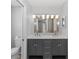 Well-lit bathroom with double vanity and ample storage space at 7322 Ellis Ln, Port Charlotte, FL 33981
