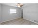 Vacant bedroom with updated floors, ample lighting, and neutral paint at 7322 Ellis Ln, Port Charlotte, FL 33981