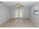 Bright bedroom with wood floors and French doors at 7322 Ellis Ln, Port Charlotte, FL 33981