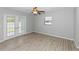 Bedroom featuring wood floors, natural lighting, and ceiling fan at 7322 Ellis Ln, Port Charlotte, FL 33981