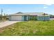 Charming single-story home with a well-manicured lawn, attached two-car garage and classic curb appeal at 7322 Ellis Ln, Port Charlotte, FL 33981