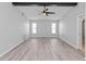 Spacious living room featuring wood floors, neutral walls, and great natural lighting at 7322 Ellis Ln, Port Charlotte, FL 33981