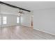 Inviting living room featuring wood floors, neutral walls, and great natural lighting at 7322 Ellis Ln, Port Charlotte, FL 33981