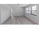Bright living room featuring large windows that let in natural light and new flooring at 7322 Ellis Ln, Port Charlotte, FL 33981