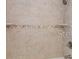 Shower with tiled walls, fixtures, and a built-in shelf for storage at 7322 Ellis Ln, Port Charlotte, FL 33981