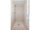 Tiled stand up shower with shower head and built in features at 7322 Ellis Ln, Port Charlotte, FL 33981