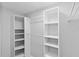 Well-organized walk-in closet with shelves and racks at 7322 Ellis Ln, Port Charlotte, FL 33981