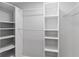 Walk-in closet featuring ample shelving and rod space at 7322 Ellis Ln, Port Charlotte, FL 33981