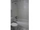 Full bathroom showcasing a white tiled shower and bathtub combination at 8220 12Th N Way # H, St Petersburg, FL 33702