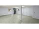 Finished basement with tile floors, spiral staircase, and ample space for entertainment or storage at 859 Harbor Hill Dr, Safety Harbor, FL 34695