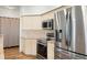 Bright kitchen with stainless steel appliances and granite countertops at 859 Harbor Hill Dr, Safety Harbor, FL 34695
