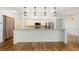 Spacious open kitchen with stainless steel appliances, breakfast bar, and ample counter space at 859 Harbor Hill Dr, Safety Harbor, FL 34695