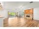 Open living room with fireplace and sliding glass doors to the deck at 859 Harbor Hill Dr, Safety Harbor, FL 34695
