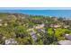 Breathtaking aerial view showcasing a serene waterfront community with mature trees and stunning coastal scenery at 859 Patterson Dr, Sarasota, FL 34234