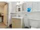 Stylish bathroom with modern vanity, chevron patterned walls and vanity mirror at 859 Patterson Dr, Sarasota, FL 34234