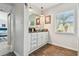 Bright bathroom with white cabinetry, ample storage, and a vessel sink at 859 Patterson Dr, Sarasota, FL 34234