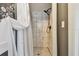 Modern shower with marble tiling, hexagon floor and rainfall shower head at 859 Patterson Dr, Sarasota, FL 34234