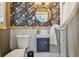 Stylish bathroom with floral wallpaper, gold fixtures, and a unique sink at 859 Patterson Dr, Sarasota, FL 34234