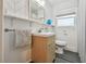 Bathroom features modern vanity, chevron wall tiling, and a window for natural light at 859 Patterson Dr, Sarasota, FL 34234