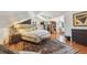 Bedroom featuring hardwood floors, sloped ceilings, large area rug, and ample natural light at 859 Patterson Dr, Sarasota, FL 34234