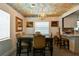 Charming dining room with artistic ceiling, chandelier, window, wood table, and seating for six at 859 Patterson Dr, Sarasota, FL 34234