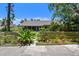 Charming single-story home featuring a well-kept lawn and inviting walkway at 859 Patterson Dr, Sarasota, FL 34234