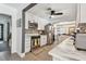 Kitchen featuring stainless steel appliances, white cabinets, granite countertops, and open to dining area at 859 Patterson Dr, Sarasota, FL 34234