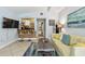 Living room with counter seating overlooking an open kitchen space at 859 Patterson Dr, Sarasota, FL 34234