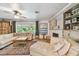 Spacious living room featuring hardwood floors, fireplace, comfortable furniture, and natural light at 859 Patterson Dr, Sarasota, FL 34234