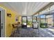 Cozy covered patio with a grill, plants, and seamless transition to outdoor living at 859 Patterson Dr, Sarasota, FL 34234