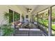 View of the porch featuring seating, ceiling fans, and screened-in windows at 859 Patterson Dr, Sarasota, FL 34234