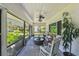 Spacious screened-in porch with comfortable seating and ceiling fans at 859 Patterson Dr, Sarasota, FL 34234