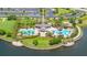 Aerial view of the neighborhood community pool with a splash pad, swimming pool, and outdoor seating at 9860 Smarty Jones Dr, Ruskin, FL 33573