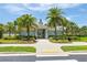 Neighborhood clubhouse with lush landscaping, pedestrian access, and bike racks for the residents to use at 9860 Smarty Jones Dr, Ruskin, FL 33573