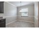 A dining area featuring a hanging light fixture, a window, and light-colored walls at 9860 Smarty Jones Dr, Ruskin, FL 33573