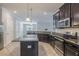 A kitchen island is featured with stainless steel appliances and a neutral color palette at 9860 Smarty Jones Dr, Ruskin, FL 33573